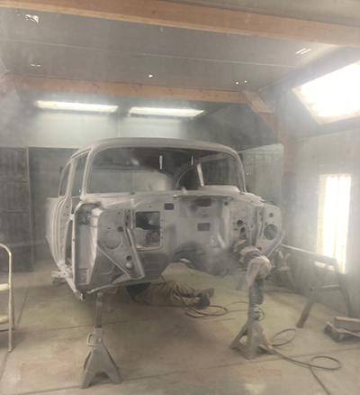 1957 Chevy 210 primed in booth